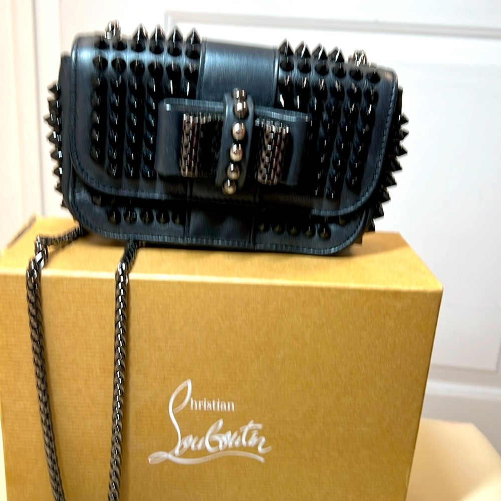 Louboutin black on black “sweetie” cross body with spikes
